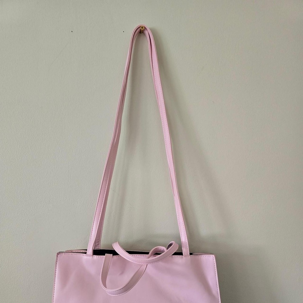 Pink embossed tote bag with double handles